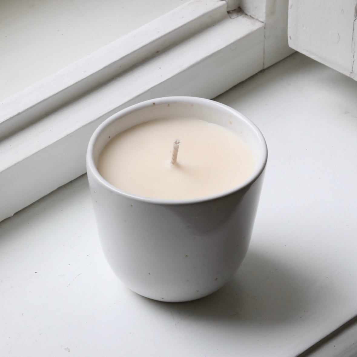 Bougie parfumée dans une coupe Cappuccino