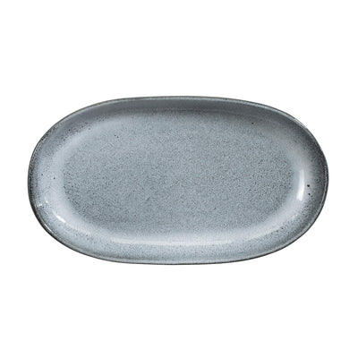 Soucoupe bleue détachée sur fond blanc